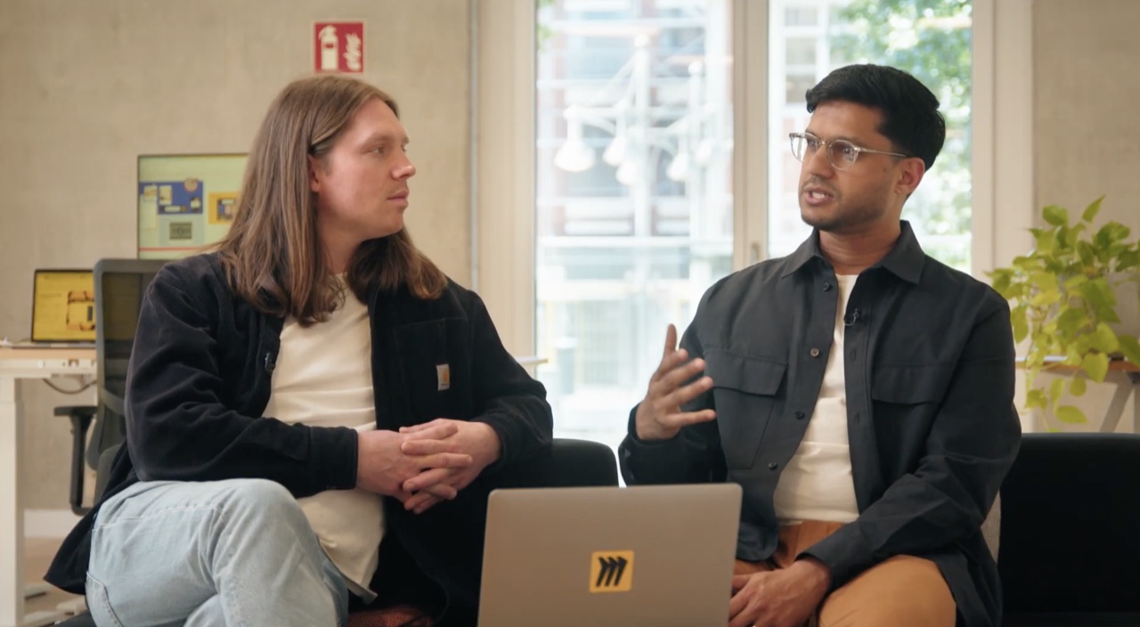 Vihar talking with a fellow product manager about senior PM skills